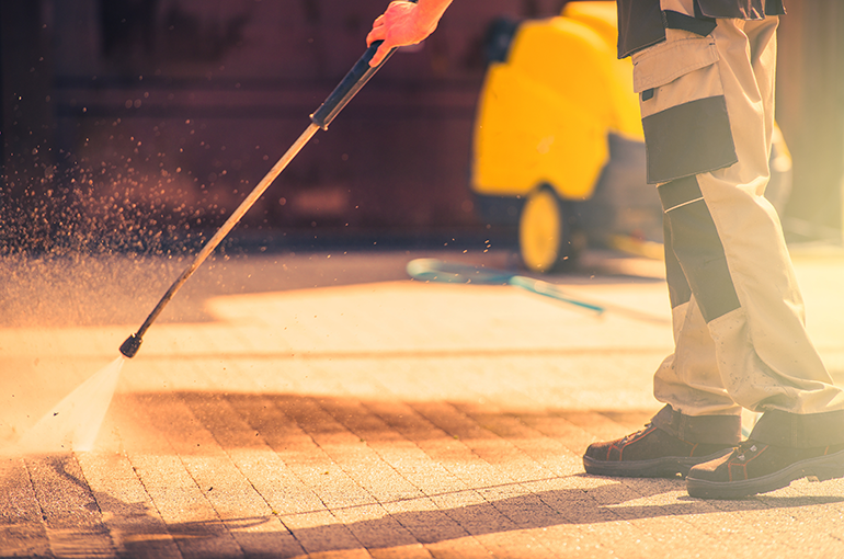 high pressure wash technique to remove grease from pavement